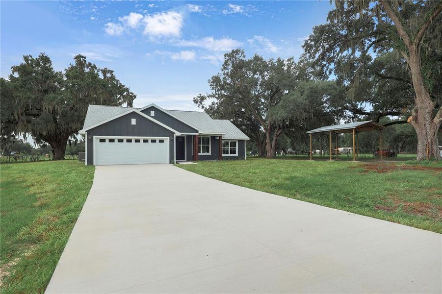 Front exterior of a new home in , Bushnell, FL, highlighting curb appeal (Image 21).