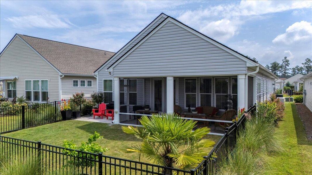 Front exterior of a new home in K. Hovnanian's® Four Seasons at Lakes of Cane Bay, Summerville, SC, highlighting curb appeal (Image 25).