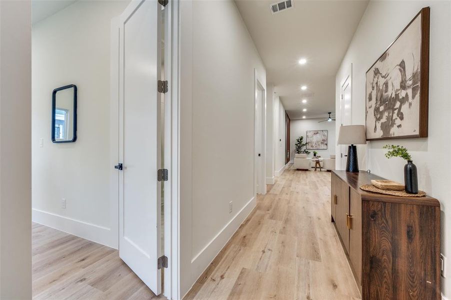 Hall with recessed lighting and light wood finished floors