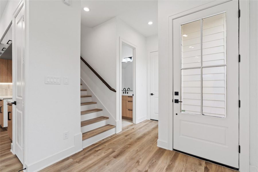 Large living room with backyard access and a clean, modern feel.