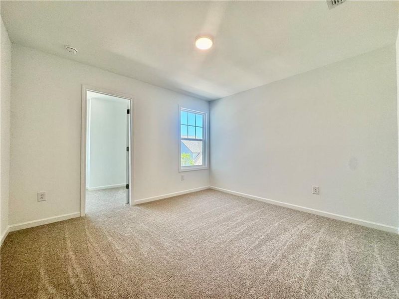 Spacious, unfurnished interior of a new home in Eastlyn Crossing, Flowery Branch (Image 28).