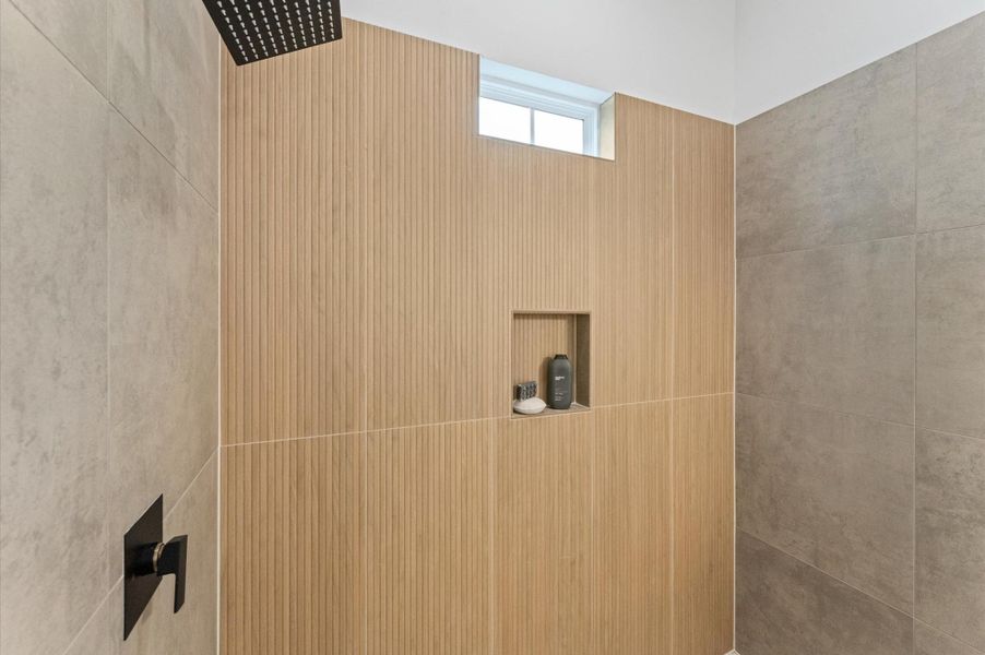 This stylish primary bathroom showcases a spacious walk-in shower framed with sleek glass panels and modern tilework that adds texture and sophistication. A double sink vanity anchors the space with clean lines and ample countertop room, complemented by an abundance of cabinetry that offers both function and flair. Contemporary finishes tie the room together, creating a polished retreat that balances luxury with everyday practicality. This stylish primary bathroom showcases a spacious walk-in shower framed with sleek glass panels and modern tilework that adds texture and sophistication. A double sink vanity anchors the space with clean lines and ample countertop room, complemented by an abundance of cabinetry that offers both function and flair. Contemporary finishes tie the room together, creating a polished retreat that balances luxury with everyday practicality.