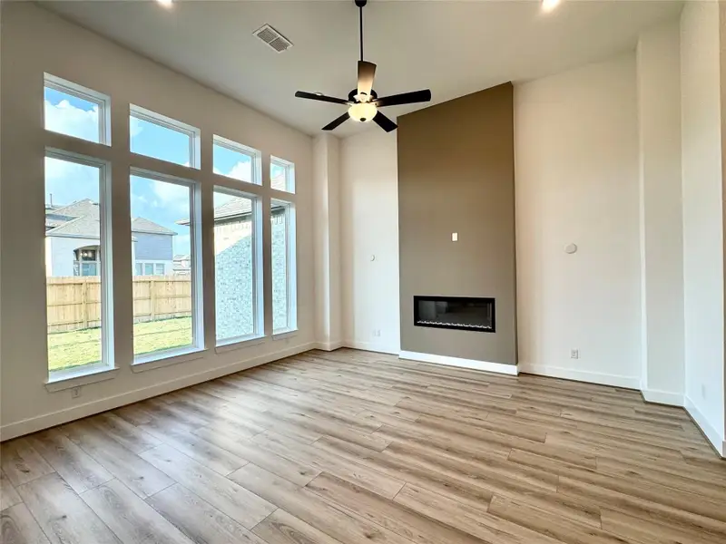 Family Room - High ceilings - electric fireplace Open to Kitchen and Breakfast area