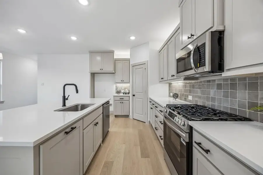 Featuring ample storage and prep space combined with beautiful finishes, this dream kitchen is all that you have been searching for!