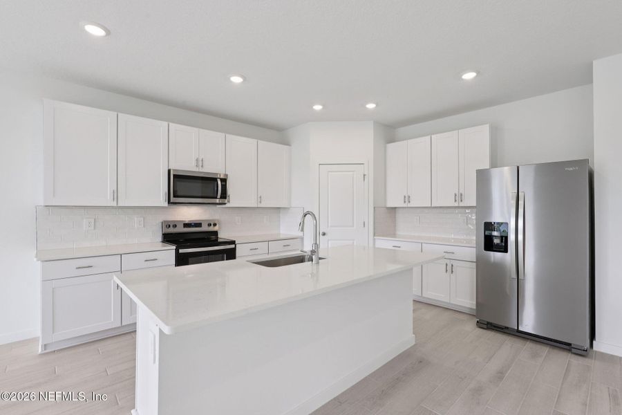 Furnished interior view inside a new home in Colbert Landings, Palm Coast (Image 5).