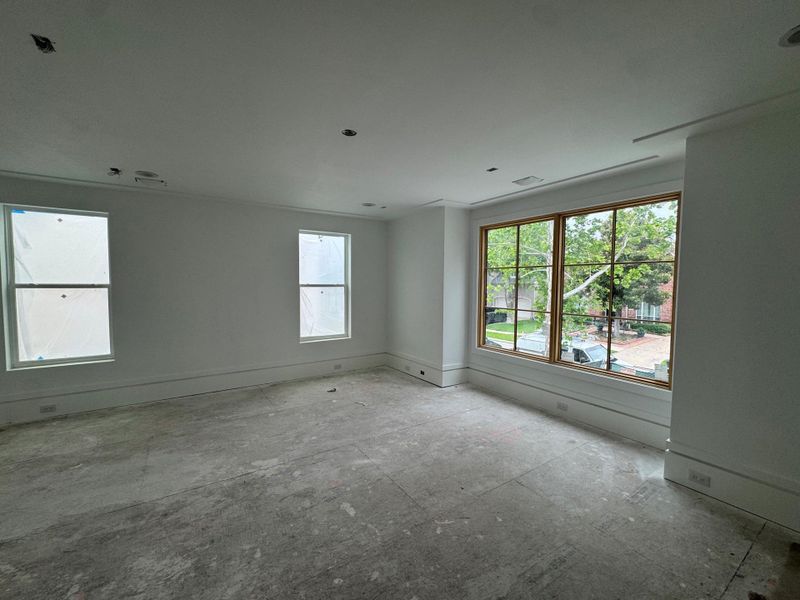 Expansive first-floor bonus room offering exceptional flexibility for a home office, game room, media room, or fitness space. Pre-wired for 7.1 surround sound for an enhanced entertainment experience.