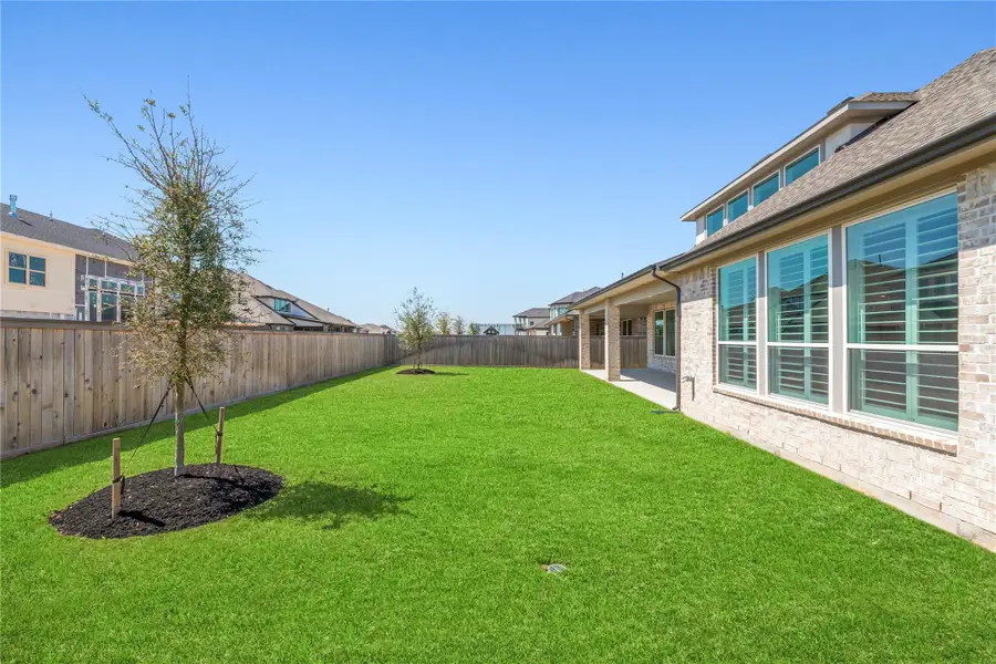 Exterior details and patio area of a home in Bridgeland, Cypress (Image 3).