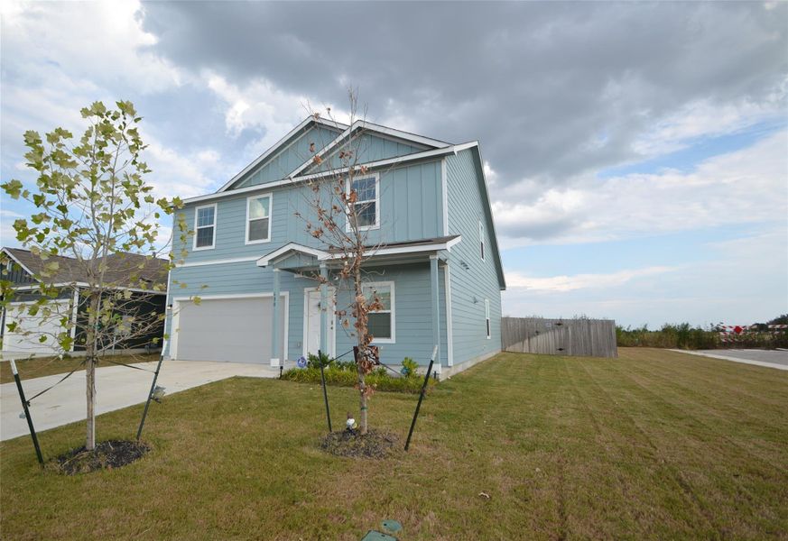 View of front of home featuring an attached garage and concrete driveway