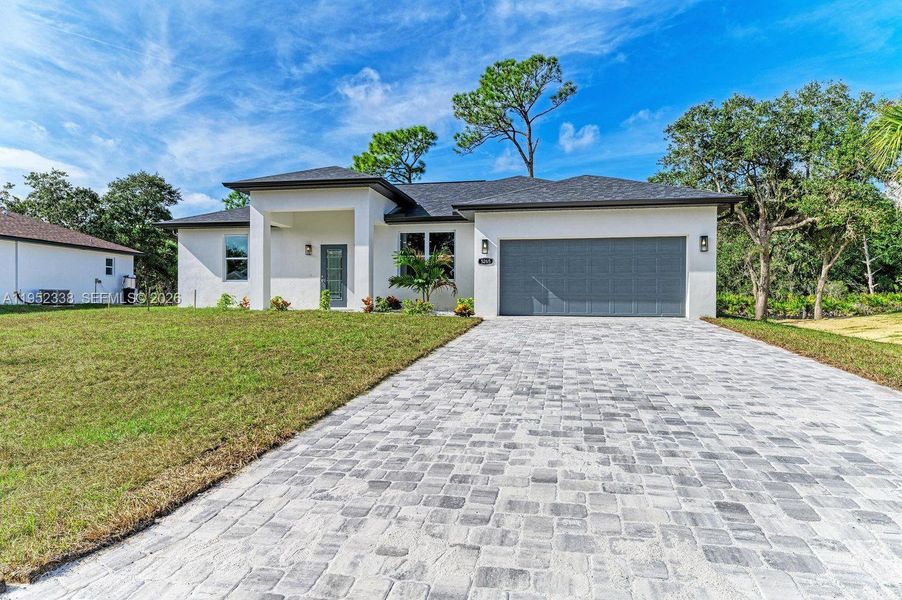 Front exterior of a new home in , North Port, FL, highlighting curb appeal (Image 24).