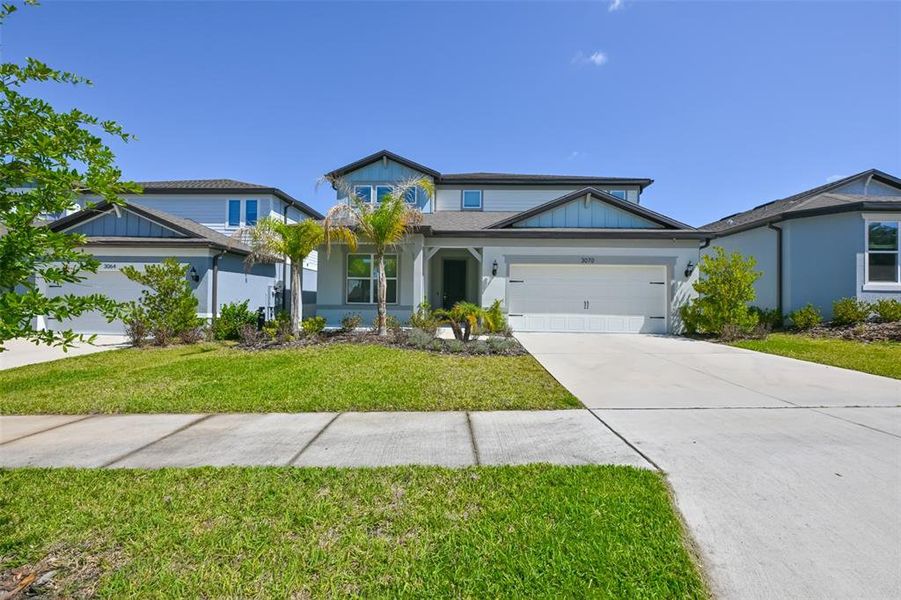 Front exterior of a new home in , Valrico, FL, highlighting curb appeal (Image 26).