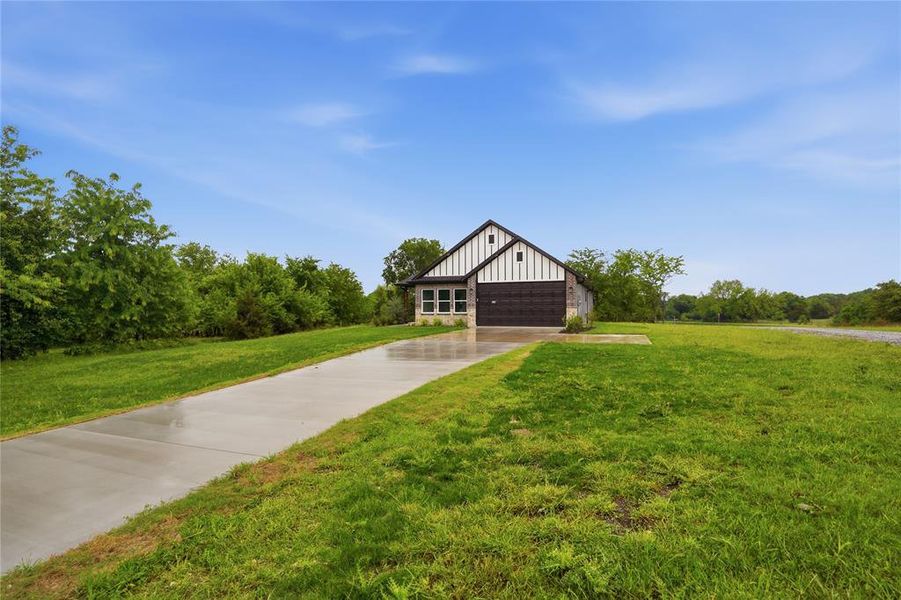 Front exterior of a new home in , Tom Bean, TX, highlighting curb appeal (Image 22).