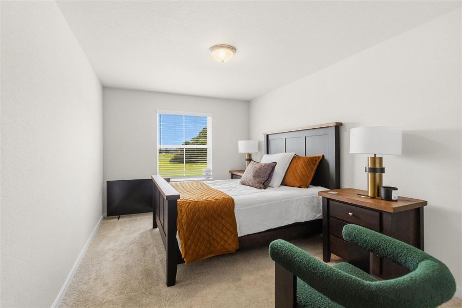 Designed for comfort and versatility, your first secondary bedroom is spacious and offers natural light, plush carpeting, and room for a variety of furniture arrangements.