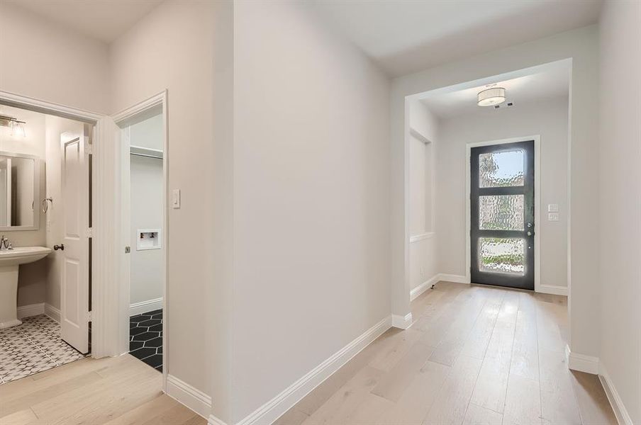 Tiled entrance foyer featuring sink