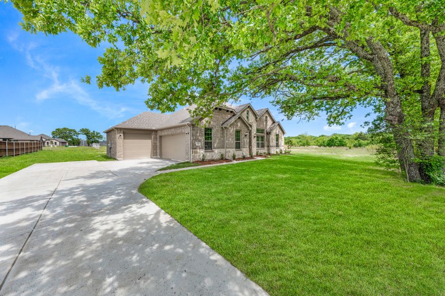 Front exterior of a new home in Lakeview Estates, Canton, TX, highlighting curb appeal (Image 26).