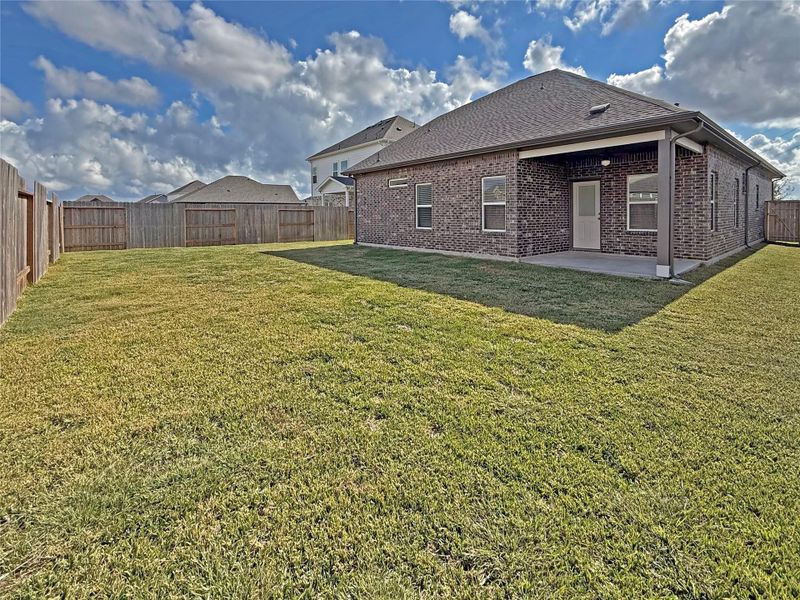Exterior details and patio area of a home in Sierra Vista, Iowa Colony (Image 3).