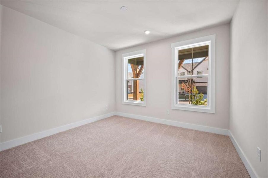 Spacious, unfurnished interior of a new home in The Paddocks at Doc Hughes, Buford (Image 26).