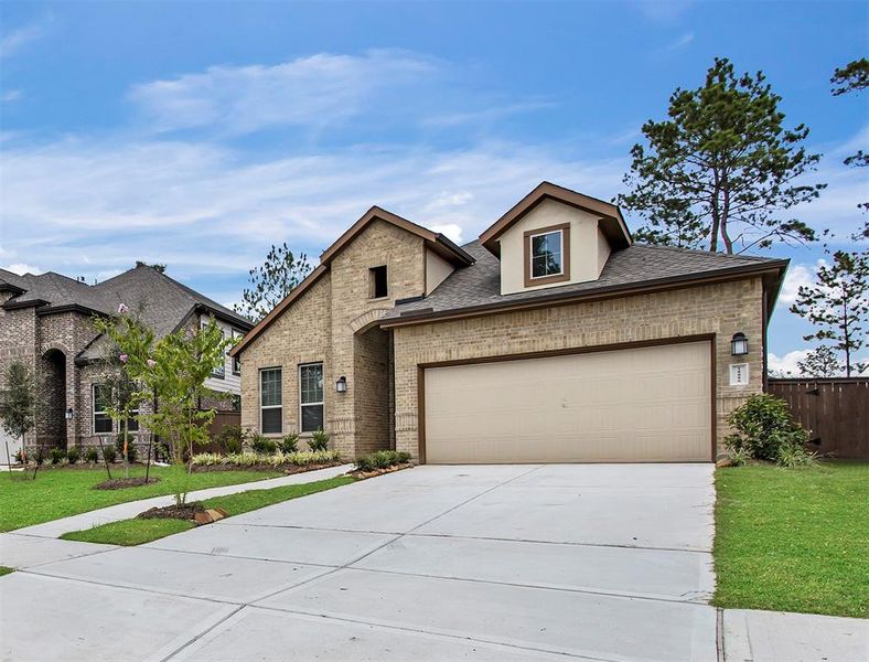 Front exterior of a new home in Wood Leaf Reserve, Tomball, TX, highlighting curb appeal (Image 25).