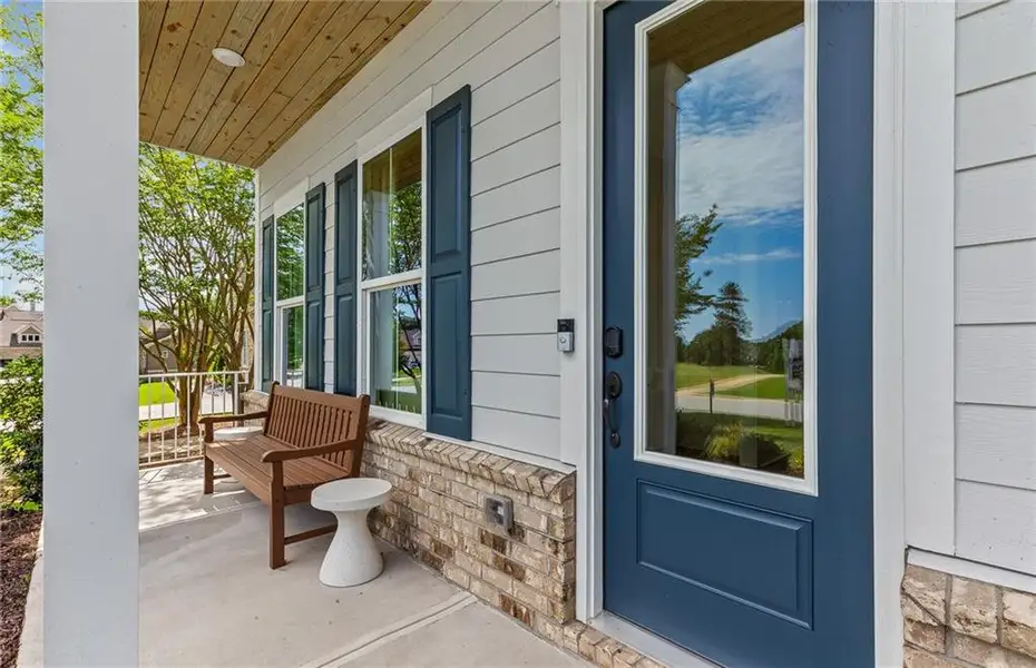 Exterior details and patio area of a home in Creekside at Skelton, Hoschton (Image 3).