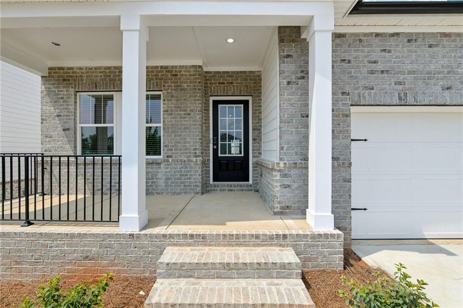 Exterior details and patio area of a home in Martin Springs - Estate Series, Lawrenceville (Image 4).