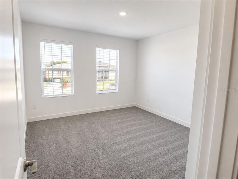 Spacious, unfurnished interior of a new home in Triple Creek: The Executives, Riverview (Image 22).