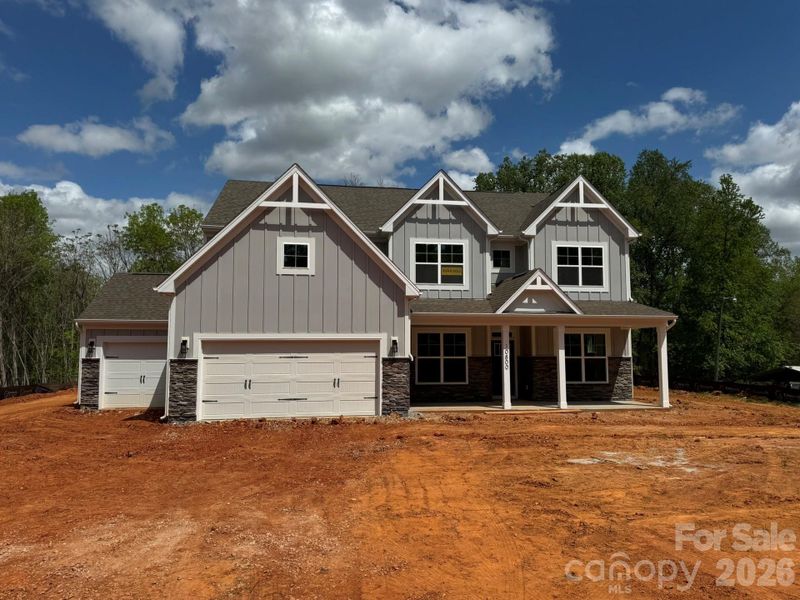 Homesite 58 features a Charleston plan with 3-car garage