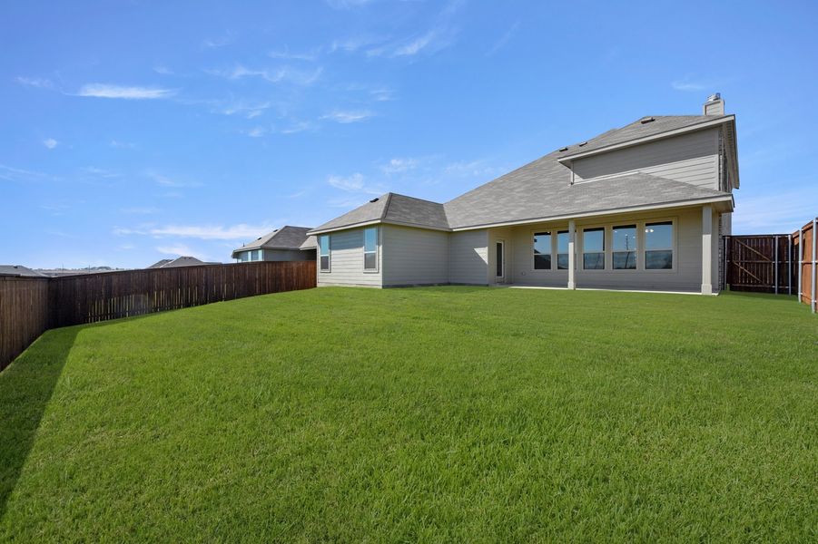 Front exterior of a new home in Still Water Lake Estates, Godley, TX, highlighting curb appeal (Image 27). Front exterior of a new home in Still Water Lake Estates, Godley, TX, highlighting curb appeal (Image 27).