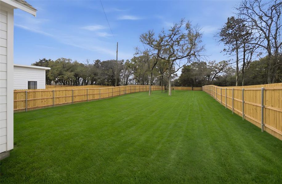 View of fenced backyard