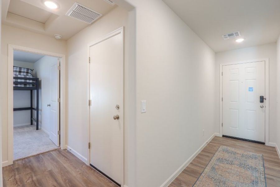 A hallway with white doors.
