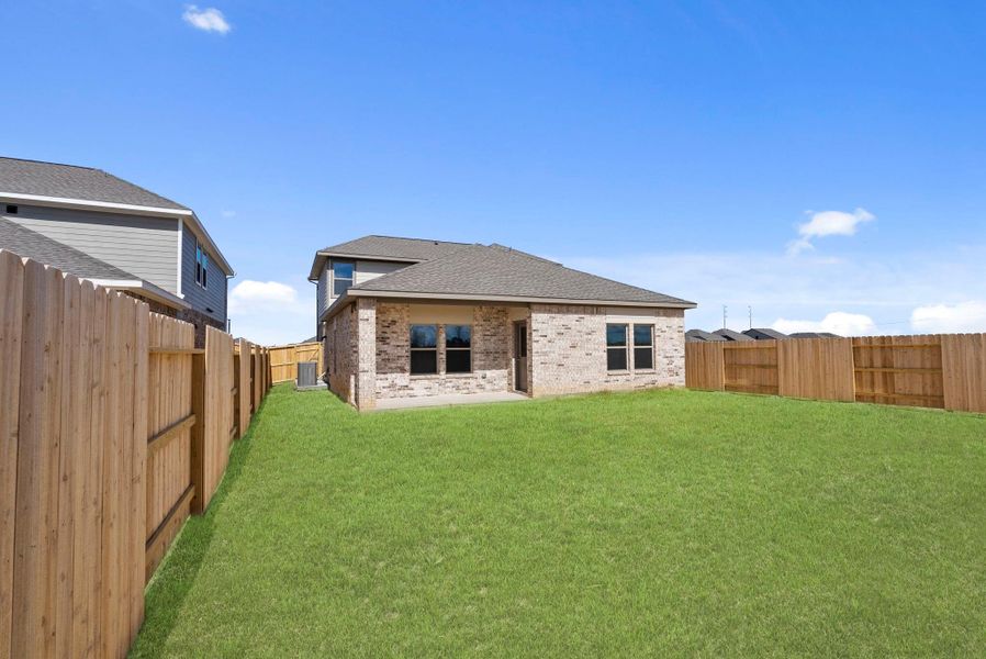 Exterior details and patio area of a home in Windrose Green, Angleton (Image 23).