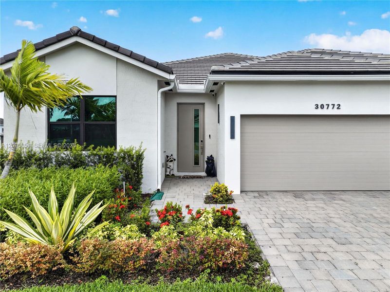 Front exterior of a new home in , Homestead, FL, highlighting curb appeal (Image 22).