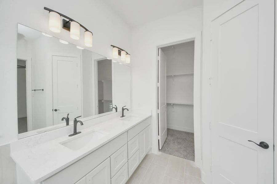 Representative furnished interior of a home built from the Bonneville by Chesmar Homes in Meridiana 50's and 60's, Manvel (Image 15).