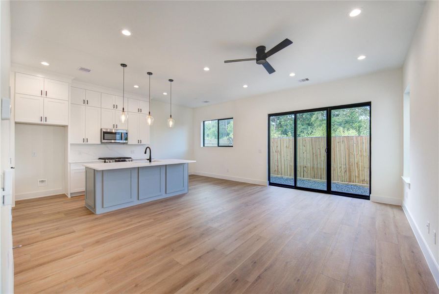 Enjoy seamless indoor-outdoor living with a sliding patio door opening to a private, fenced backyard. Enjoy seamless indoor-outdoor living with a sliding patio door opening to a private, fenced backyard.