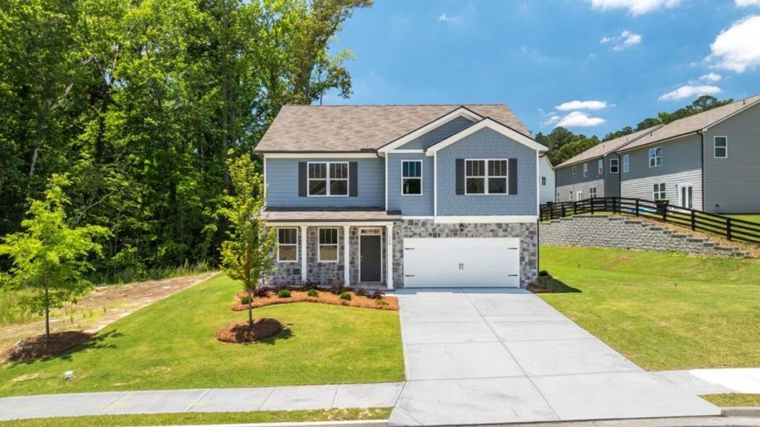 Front exterior of a new home in Northwoods at Mirror Lake, Villa Rica, GA, highlighting curb appeal (Image 2). Front exterior of a new home in Northwoods at Mirror Lake, Villa Rica, GA, highlighting curb appeal (Image 2).