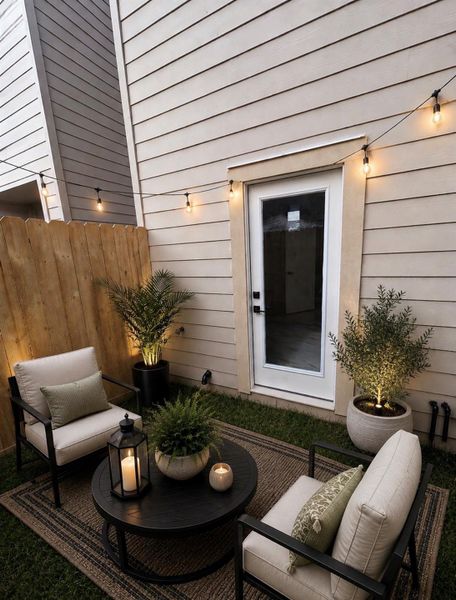 Private fenced yard with direct outdoor access from first-floor guest suite