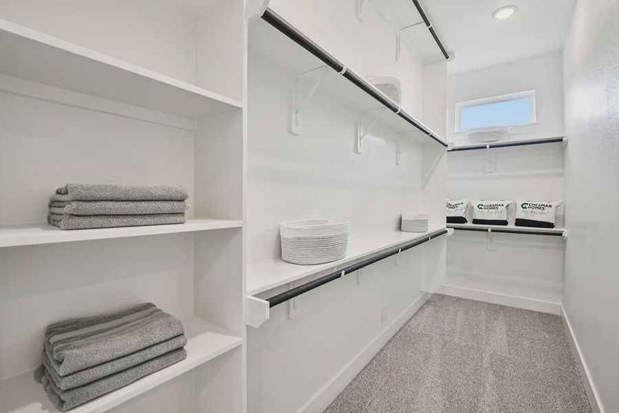 Furnished interior view inside a new home in Meridiana Chateau, Manvel (Image 12).