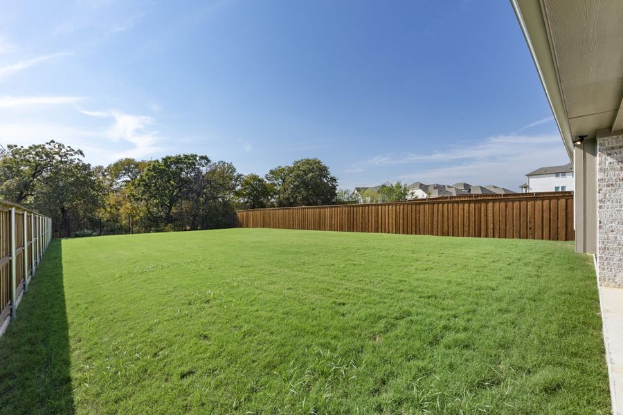 Exterior details and patio area of a home in The Reserve at Spiritas Ranch, Little Elm (Image 25).