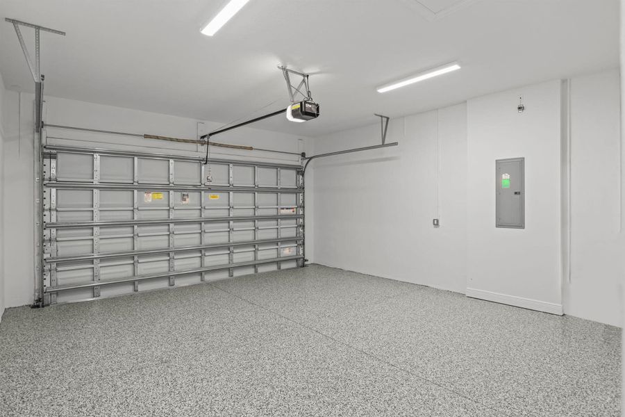 Front exterior of a new home in Cove Royale, Stuart, FL, highlighting curb appeal (Image 2).