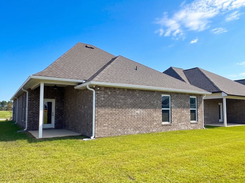 Front exterior of a new home in Natureview, Freeport, FL, highlighting curb appeal (Image 15). Front exterior of a new home in Natureview, Freeport, FL, highlighting curb appeal (Image 15).