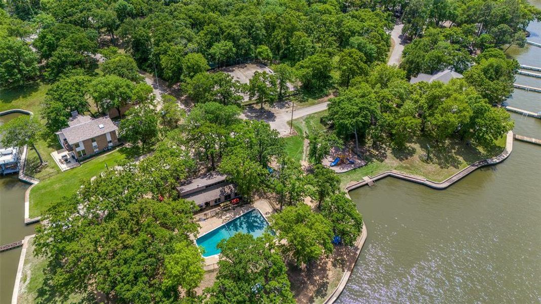 Community clubhouse has paved parking, large pool overlooking the lake, playground and tennis court. Community clubhouse has paved parking, large pool overlooking the lake, playground and tennis court.