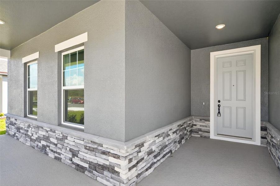 Exterior details and patio area of a home in Tyson Reserve, St. Cloud (Image 18).