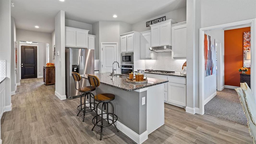 Kitchen - All Home and community information, including pricing, included features, terms, availability and amenities, are subject to change at any time without notice or obligation. All Drawings, pictures, photographs, video, square footages, floor plans, elevations, features, colors and sizes are approximate for illustration purposes only and will vary from the homes as built.