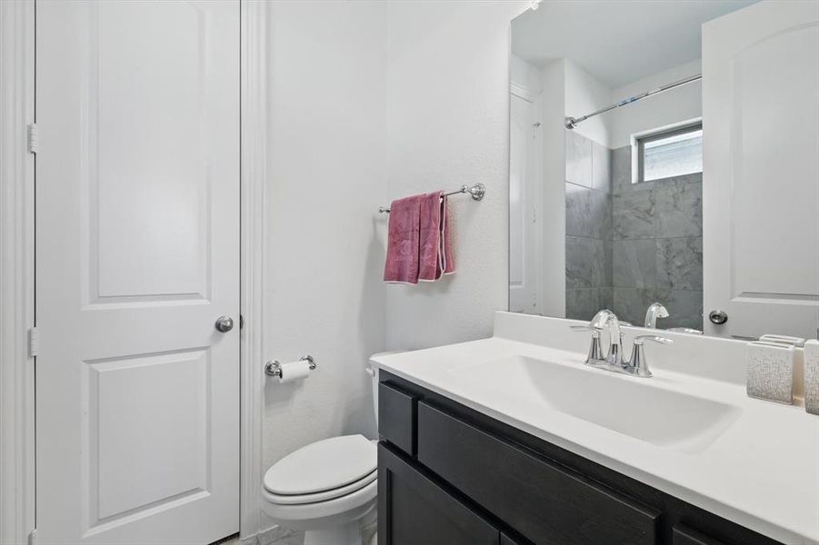 The private bath located off of bedroom 3