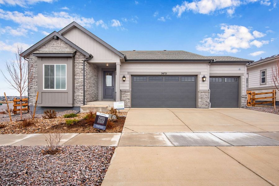 Front exterior of a new home in Ensemble at The Aurora Highlands, Aurora, CO, highlighting curb appeal (Image 1).