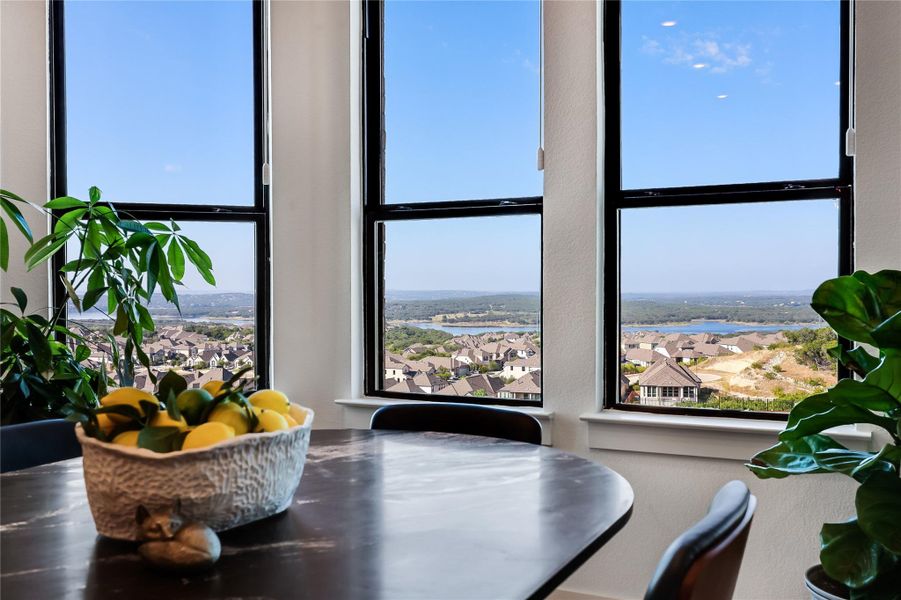 Sizable picture windows frame panoramic vistas of the surrounding neighborhood and distant water. Sizable picture windows frame panoramic vistas of the surrounding neighborhood and distant water.