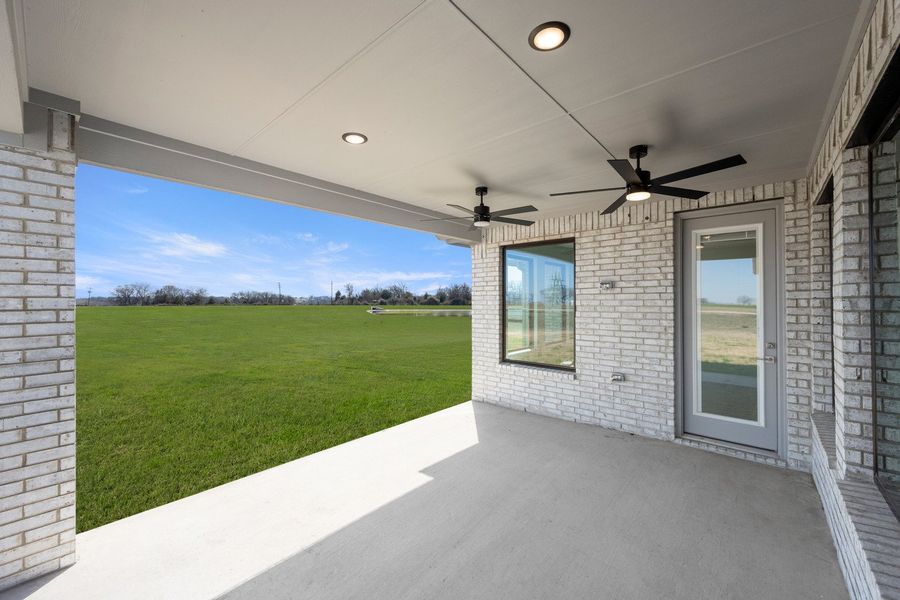Front exterior of a new home in Estates of Palmer, Waxahachie, TX, highlighting curb appeal (Image 28). Front exterior of a new home in Estates of Palmer, Waxahachie, TX, highlighting curb appeal (Image 28).