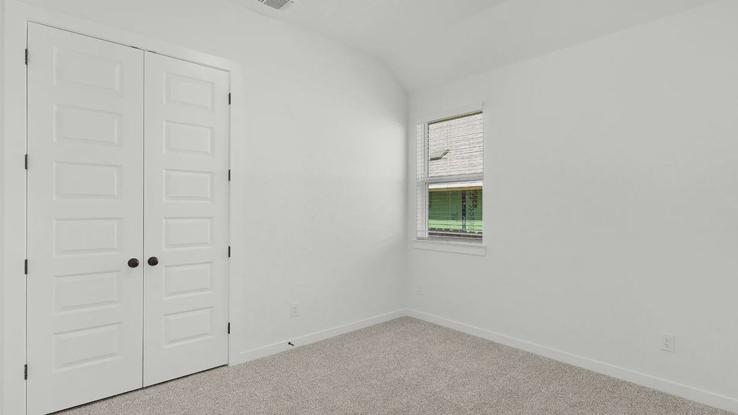 Representative unfurnished interior of a home built from the Brooks by Chesmar Homes in University Heights, Round Rock (Image 20).