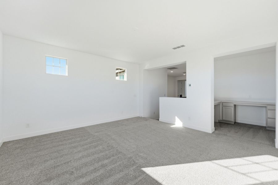 Spacious, unfurnished interior of a new home in Ellsworth Ranch, Queen Creek (Image 38).