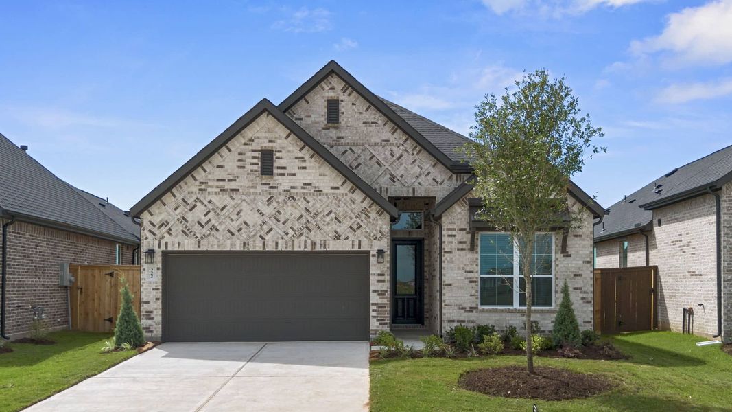 Front exterior of a new home in Brookewater, Rosenberg, TX, highlighting curb appeal (Image 16).