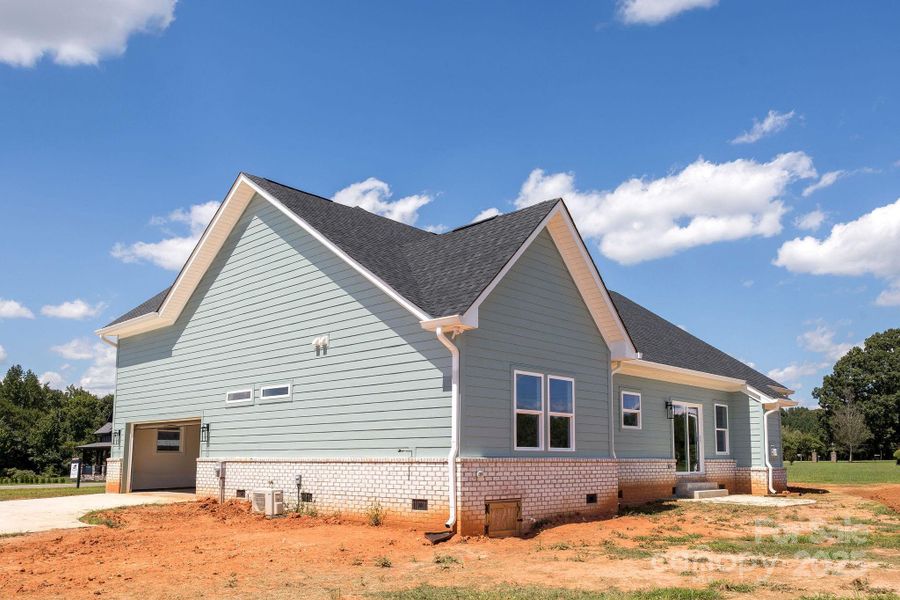 Front exterior of a new home in , Statesville, NC, highlighting curb appeal (Image 2).