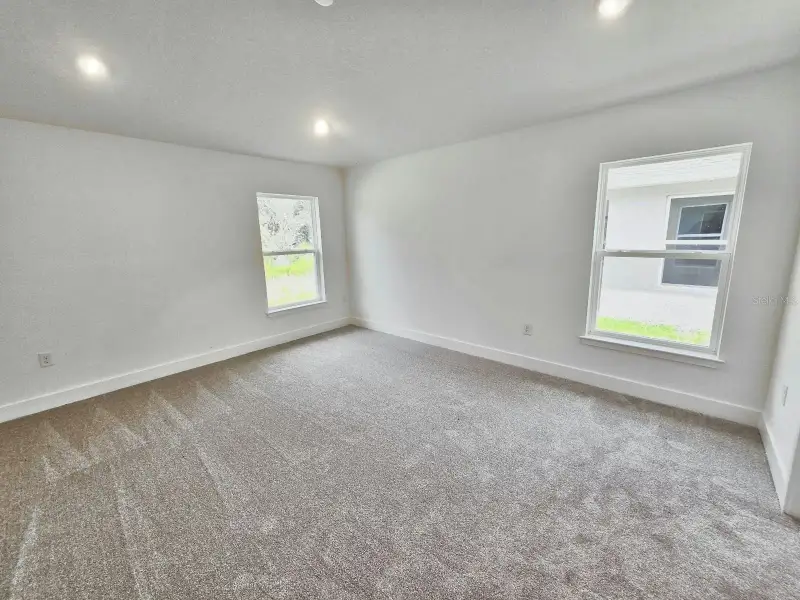 Spacious, unfurnished interior of a new home in Harmony Central, St. Cloud (Image 13).